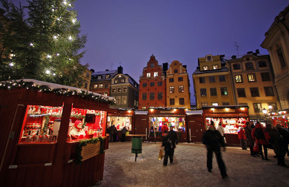 Vistors walk through the Christmas market in Stockholm's Gamla Stan district