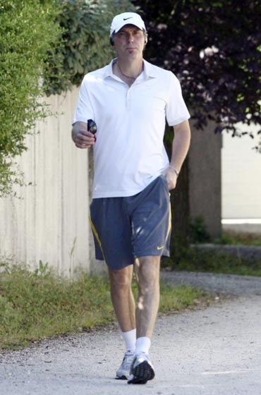 France's national soccer team coach Laurent Blanc steps out of his house for a walk
