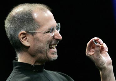 Apple CEO Steve Jobs shows the new Intel