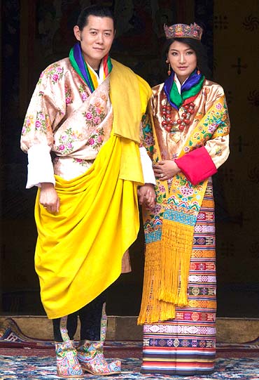 King Jigme Khesar Namgyel Wangchuck and Queen Jetsun Pema pose for pictures after their marriage at the Punkaha Dzong in Bhutan's ancient capital Punakha on October 13, 2011