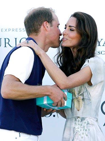 Prince William, Duke of Cambridge receives a kiss from Catherine, Duchess of Cambridge after Prince William's team won their round robin tournament at the Santa Barbara Racquet and Polo Club for a Foundation Polo Challenge that benefits the American Friends of the Foundation of Prince William and Prince Harry on July 9, 2011 in Santa Barbara, California