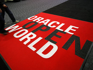 Attendees walk past a carpet at the 2011 OpenWorld Conference on October 2, 2011 at the Moscone Center in San Francisco, California. The Oracle OpenWorld Conference, the largest of its kind, will continue through October 6.