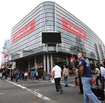 Attendees walks outside Moscone Center during the annual Oracle OpenWorld Conference on October 2, 2011 in San Francisco, California. The Oracle OpenWorld Conference, the largest of its kind, will continue through October 6.