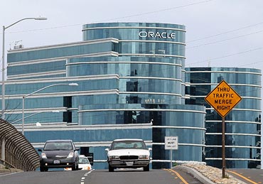 Cars drive by Oracle headquarters on March 25, 2011 in Redwood Shores, California.  Oracle reported a third quarter profit increase of 78 percent to $2.1 billion.
