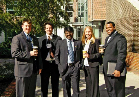 Surya (middle) with classmates at University of Florida
