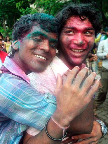 Men celebrate the court ruling over gay sex during a rally in Mumbai July 2, 2009