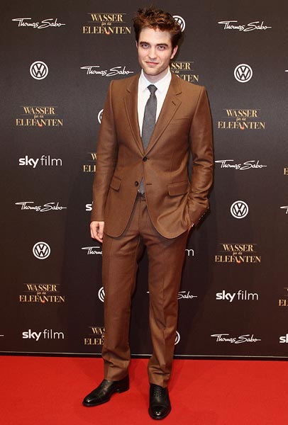 Robert Pattinson in a brown Gucci suit at the Wasser fuer die Elefanten (Water For Elephants) premiere in Berlin, Germany