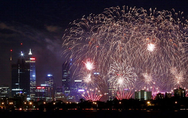 Fireworks are pictured with the Perth city skyline as Australia celebrates Australia Day