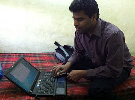 Suresh in his hostel room, demonstrating how he works with Jaws