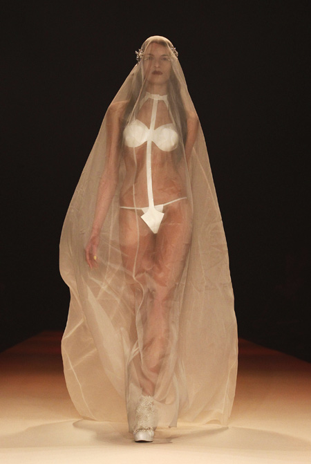 A model presents the wedding dress by Kaviar Gauche at the Berlin Fashion Week Autumn/Winter 2012