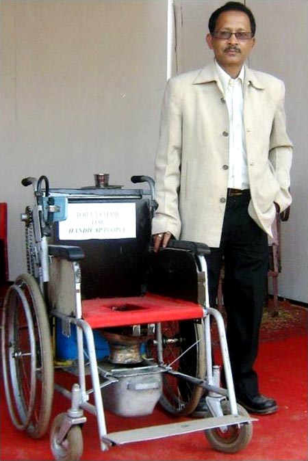Bharali with his mechanised toilet for the handicapped