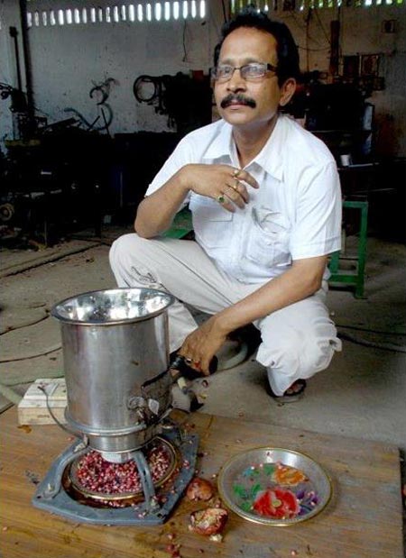 Bharali with his pomegranate de-seeder, which has been nominated for an award by NASA