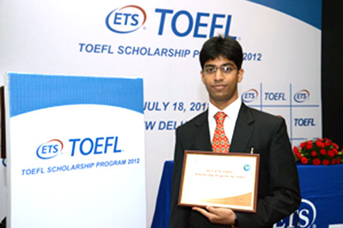 Darshan Shah receives a certificate of excellence for cracking TOEFL scholarship 2012.