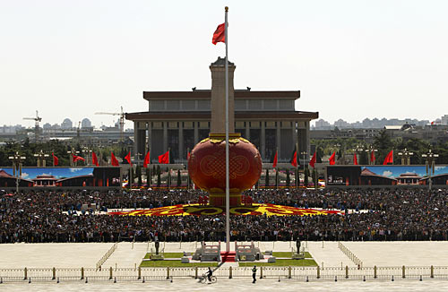 Tourists gather around a giant red lantern on display at Beijing's Tiananmen Square