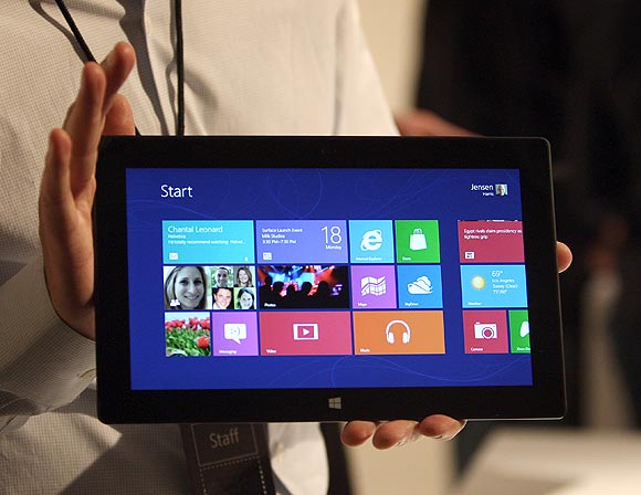 A Microsoft representative holds a new Surface tablet computer as it is unveiled by Microsoft in Los Angeles, California, June 18, 2012.