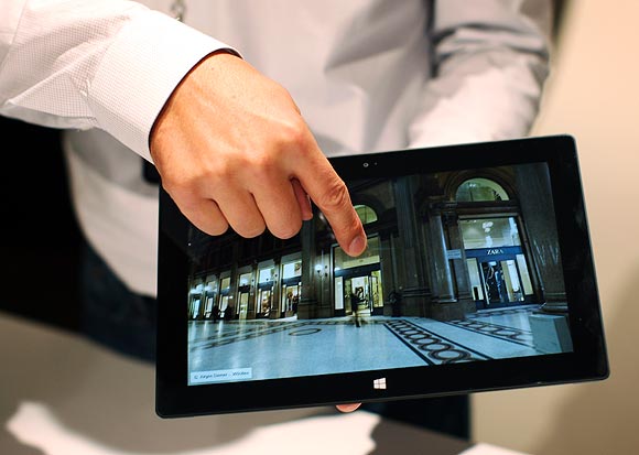A Microsoft representative scrolls the screen of the new Surface tablet computer as it is unveiled in Los Angeles, California, June 18, 2012.