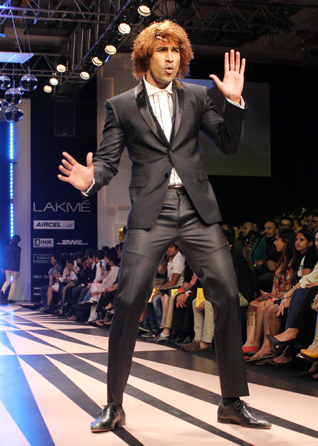 A model entertains onlookers in a Narendra Kumar outfit