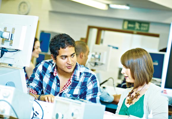 An Indian student interacts with a fellow student at Newcastle