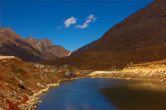 Arunachal Pradesh shares its borders with three countries -- Bhutan in the west, Burma in the east and China in the north. Literally translated as 'land of the dawn-lit mountains' Arunachal Pradesh is one of the most beautiful as well as a sensitive state given its proximity to China.