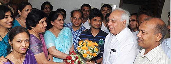 Arpit Aggarwal being congratulated by HRD minister Kapil Sibal