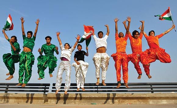 College students dressed in the colours of the national flag rehearse for the Republic Day parade in Ahmedabad, January 24, 2012. Photograph: Amit Dave/Reuters