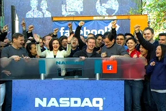 Facebook Founder and CEO Mark Zuckerberg, shown in this image from Reuters video, rings the NASDAQ Stock Market Opening Bell remotely from