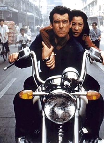Pierce Brosnan as James Bond with Michelle Yeoh in an action sequence in Tomorrow Never Dies