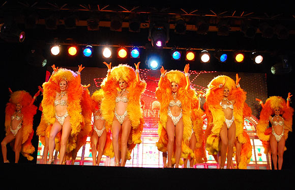 Moulin Rouge dancers perform at the Sofitel Mumbai BKC hotel in Mumbai on October 31, 2012