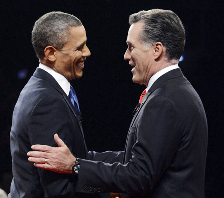 Republican presidential nominee Mitt Romney greets President Barack Obama at the start of the first 2012 US presidential debate in Denver