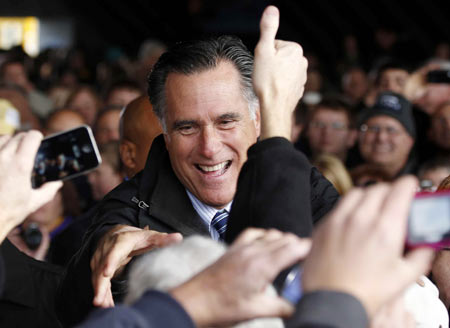 US Republican presidential nominee and former Massachusetts Governor Mitt Romney greets supporters at a campaign rally in Dubuque, Iowa, November 3, 2012.