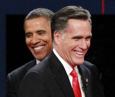 President Barack Obama (L) and Republican presidential nominee Mitt Romney share a laugh at the end of the first presidential debate in Denver October 3, 2012.
