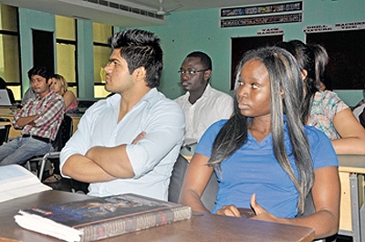 International students attend a lecture at the Manav Rachna International University, Fardabad