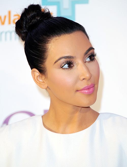 A tight ponytail or bun like Kim Kardashian's can harm your mane