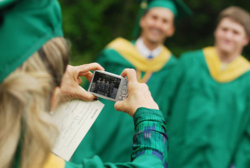 Students from George Mason University pose to get clicked on graduation day