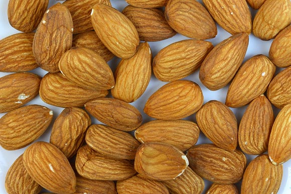 Nuts like almonds are high in polyunsaturated and monounsaturated fats, and contain naturally occurring cholesterol-lowering compounds called plant sterols