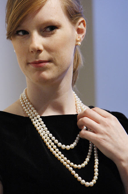Joanna Bulmer, a Bonhams employee, models a pearl necklace at the auction house in London. The necklace once belonged to Catherine the Great and was expected to fetch $500,000 - $700,000 in an auction in New York in December 2008
