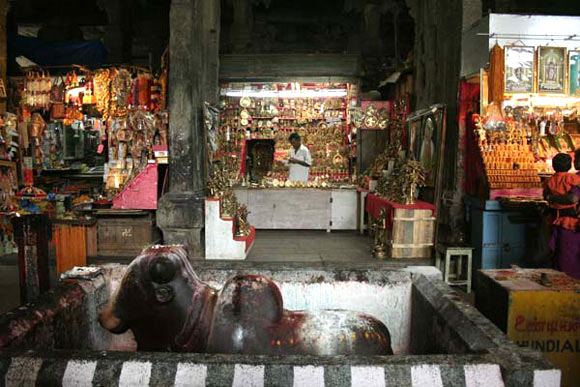 Shops selling idols and accessories inside the temple  make good profits this season