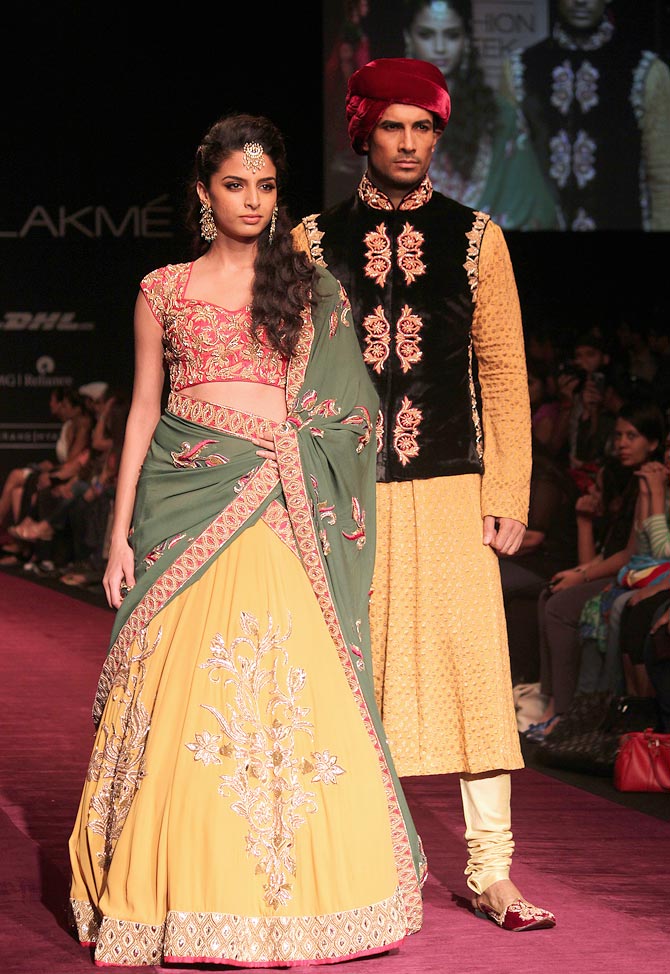 Models showcase a Shyamal and Bhumika creation.