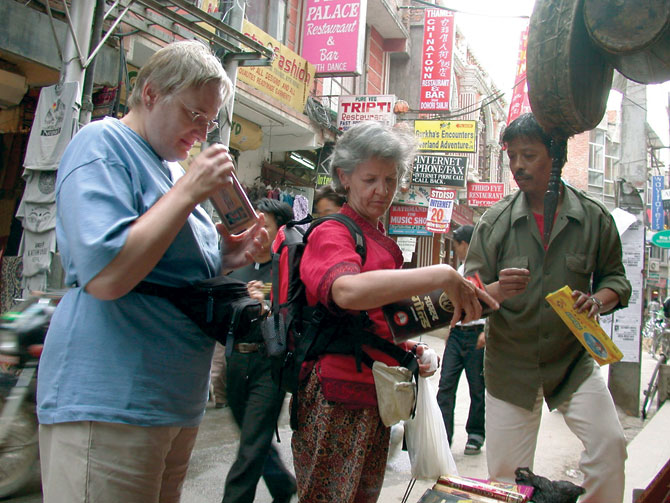 German tourists buy souvenirs at Thamel market in Kathmandu.