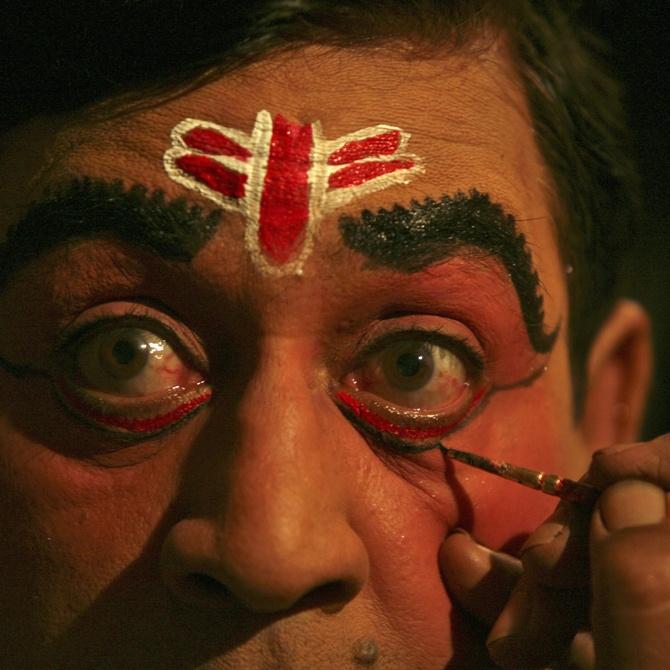 A dancer gets ready for a traditional performance