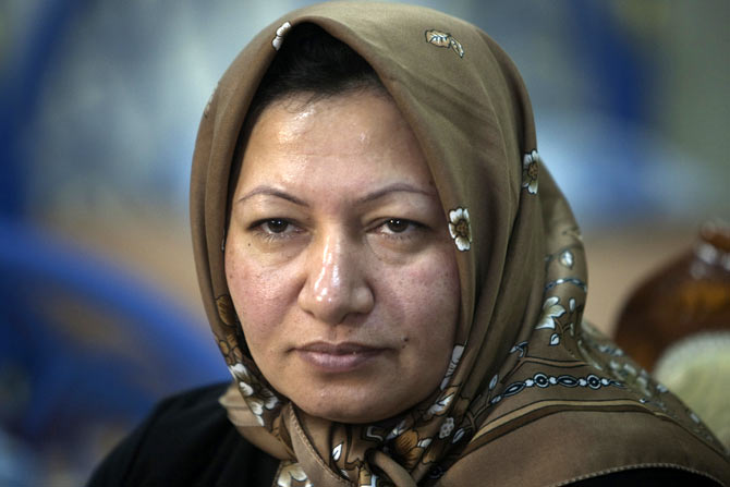 Sakineh Mohammadi Ashtiani, an Iranian woman sentenced to death by stoning, during a meeting with her son Sajjad Ghaderzadeh in Tabriz, 633 km northwest of Tehran, January 1, 2011. She had been accused of adultery and of being complicit in her husband's murder, but her sentence to be stoned to death was suspended after an international outcry.