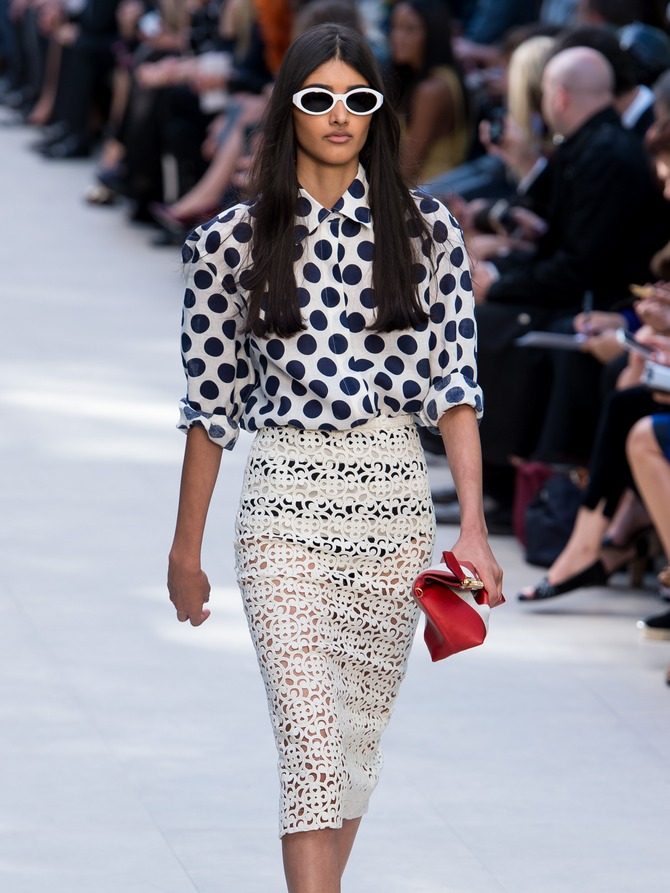 Neelam Johal walks the runway at the Burberry Prorsum show at London Fashion Week SS14 at Kensington Gardens on September 16, 2013 in London, England.