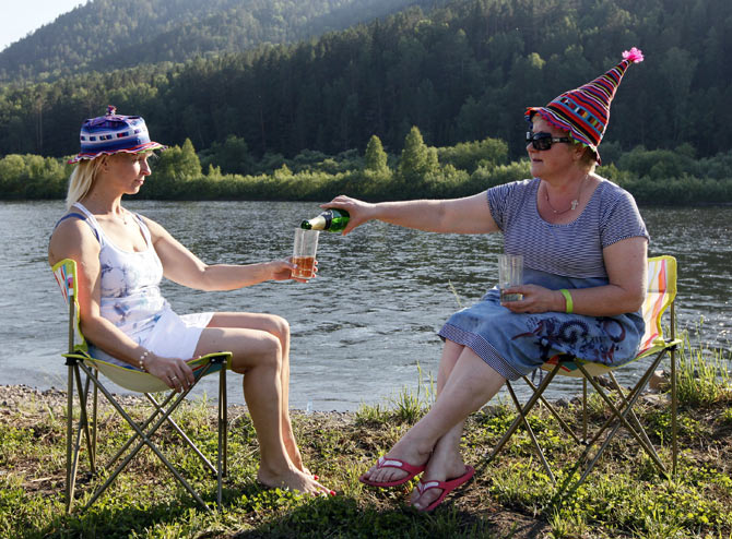 Two Russian women celebrate over champagne; Image for representational purposes only