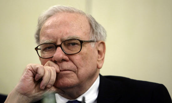 U.S. Investor Warren Buffett listens to a question during a news conference