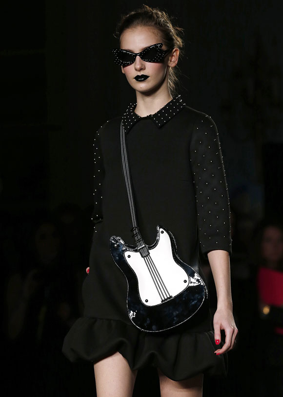 Moschino Cheap and Chic used studs and dark lip colour to heighten the Goth effect.