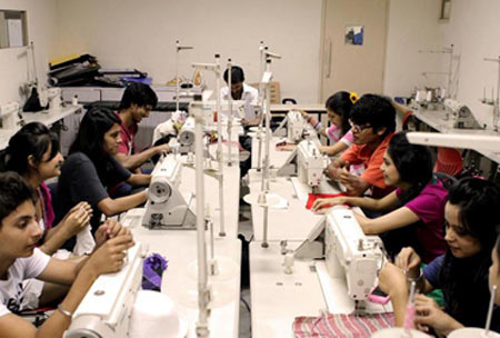 Students at JD Institute of Fashion & Technology in sewing class