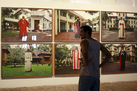 A visitor admires visual artist Anup Mathew Thomas's exhibit.