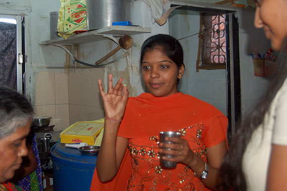 Prema inside the family kitchen taking medicines; she was running a slight fever because of exhaustion.