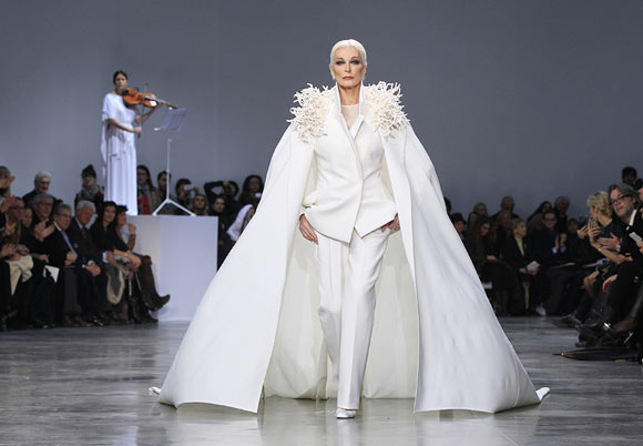 Carmen Dell'Orefice, 81, presents a creation by French designer Stephane Rolland as part of his Haute Couture Spring-Summer 2013 fashion show in Paris January 22, 2013.