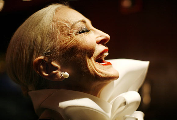 Carmen Dell'Orefice, who was born in 1931 and claims to be the world's oldest supermodel, laughs backstage before the 2007 Jackie Rogers fall collection during New York Fashion Week February 3, 2007.